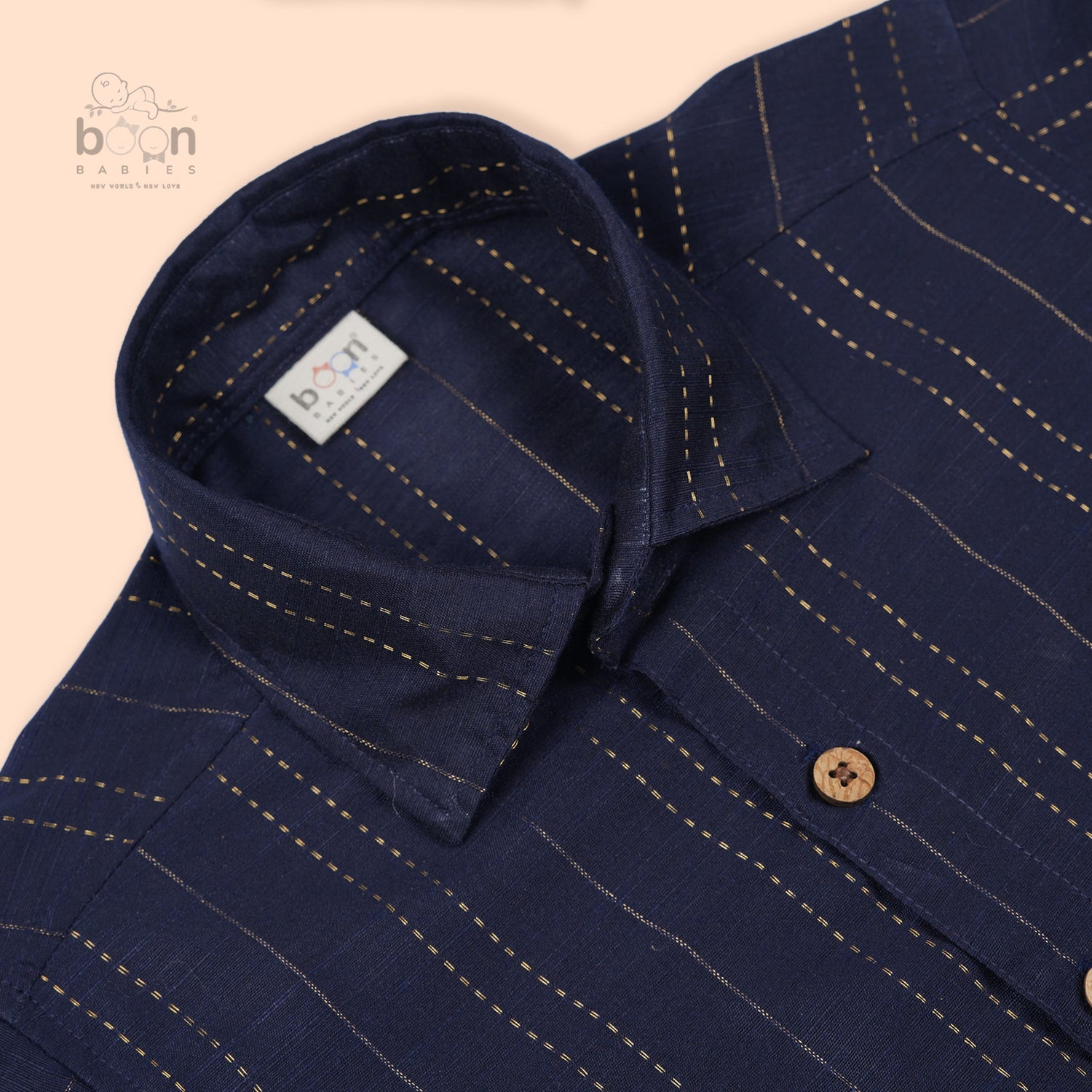 Navy blue silk shirt and ivory gold-bordered dhoti set for boys aged 12M to 5Y – traditional festive babywear combo from Boon Babies, Coimbatore.
