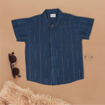 Teal blue checked silk shirt with Chinese collar and white dhoti with gold border – festive ethnic outfit for baby boys from Boon Babies.
