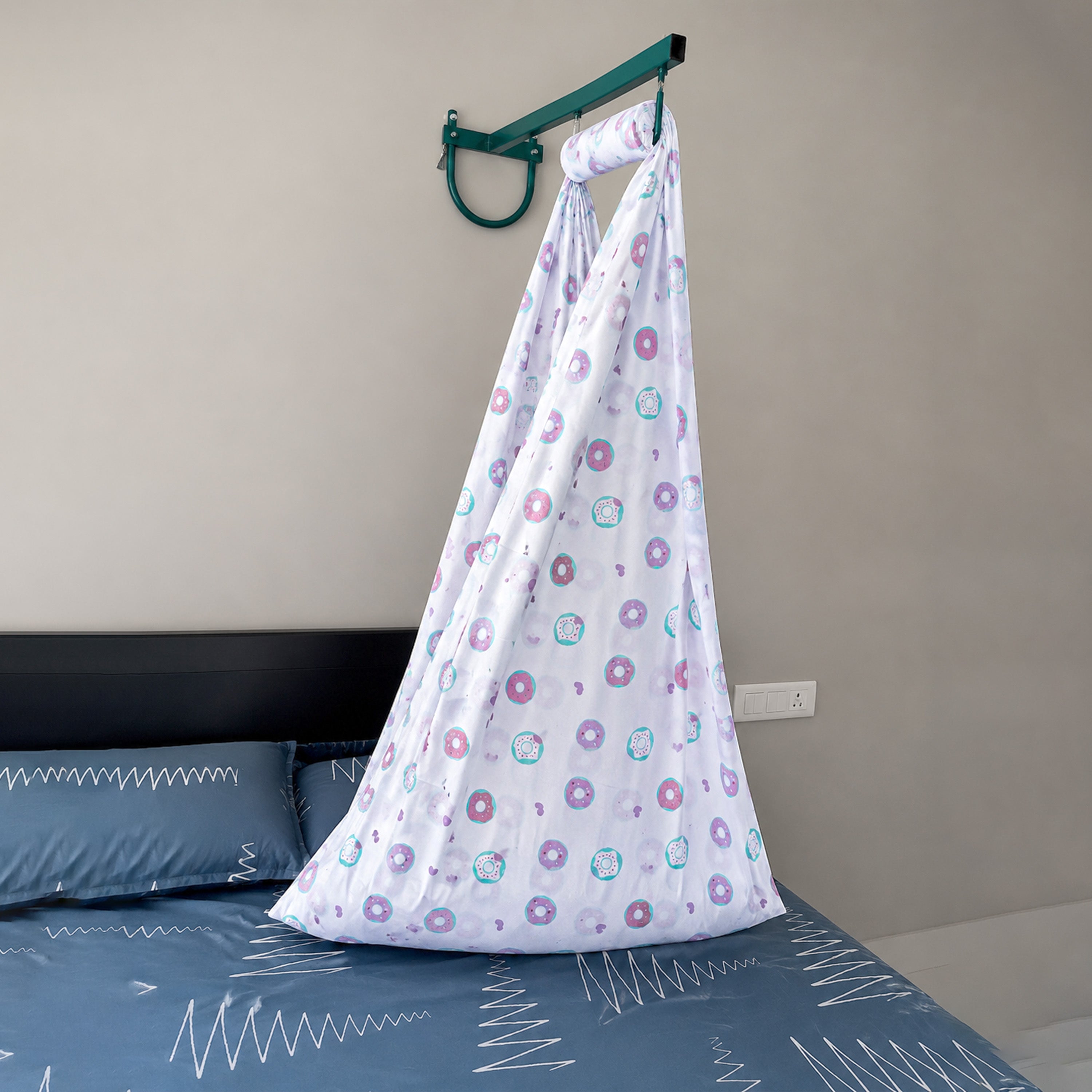 Soft cotton newborn baby cradle with purple heart print by Boon Babies, designed for gentle comfort.