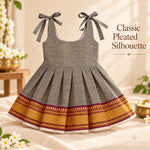 Full view of charcoal grey Mangalagiri cotton baby girl frock with maroon and gold woven hem border