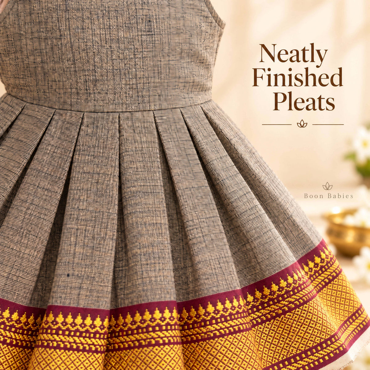Neatly finished pleats detail on charcoal grey Mangalagiri cotton baby girl frock