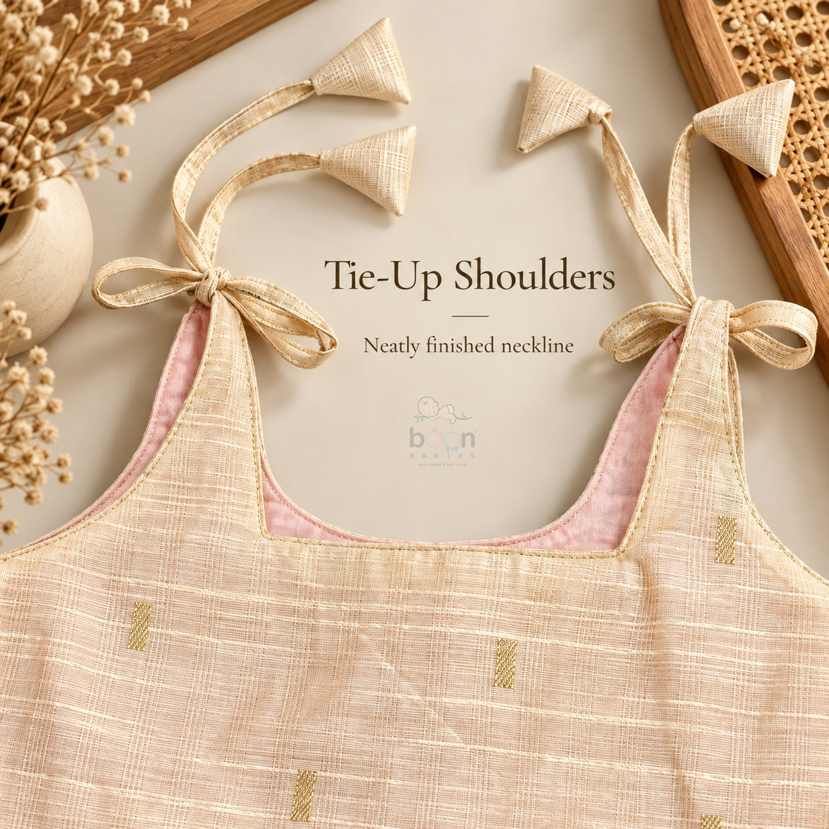 Tie-up shoulder and neatly finished neckline detail on cream tissue silk cotton baby girl frock