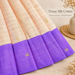 Woven tissue silk cotton texture, pleated skirt and purple border detail on cream baby girl knot frock