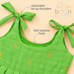 Adjustable tie-up shoulder and soft neckline detail on green tissue silk cotton baby girl frock