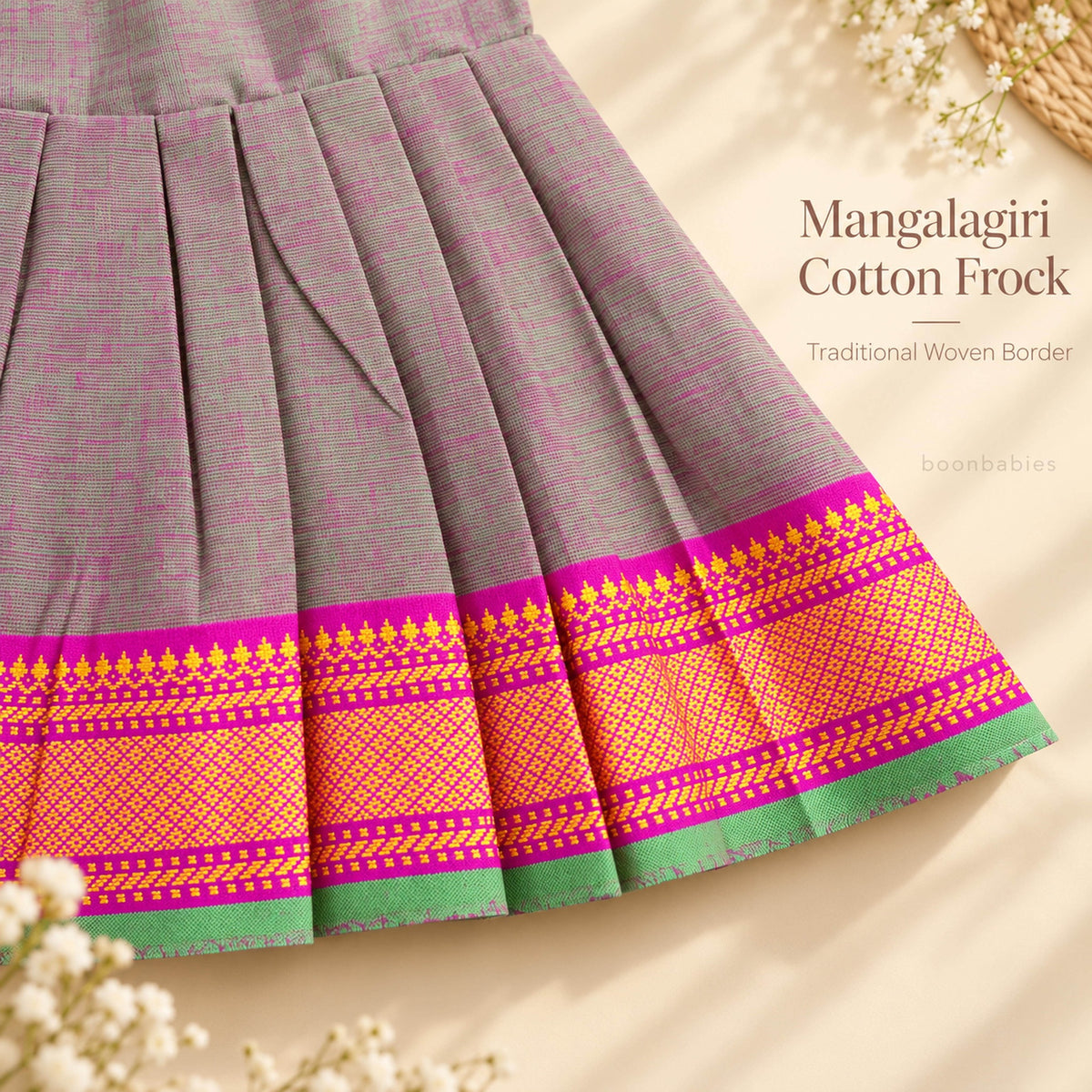 Traditional pink yellow and green woven border detail on grey Mangalagiri cotton baby girl frock