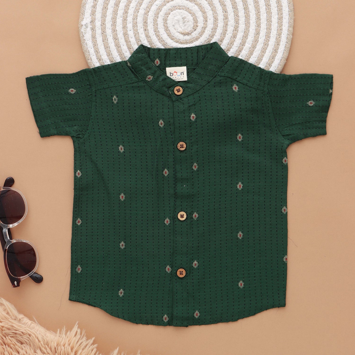 Green silk shirt with Mandarin collar paired with traditional white dhoti. Ages 6M–5Y. Perfect festive & wedding wear from Boon Babies.
