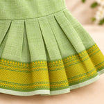Pleated skirt detail on pastel green Mangalagiri cotton baby girl frock