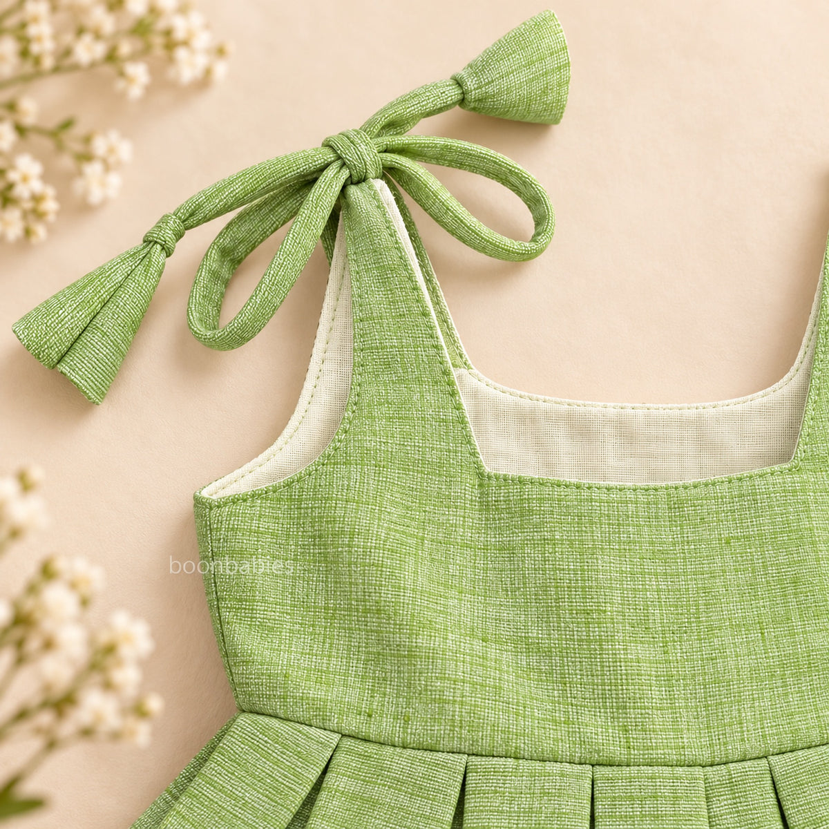 Adjustable shoulder tie detail on pastel green Mangalagiri cotton baby girl frock