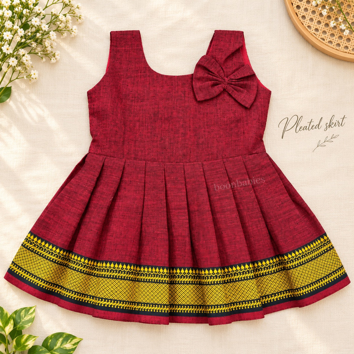 Maroon Mangalagiri cotton baby girl frock front view with pleated skirt and shoulder bow