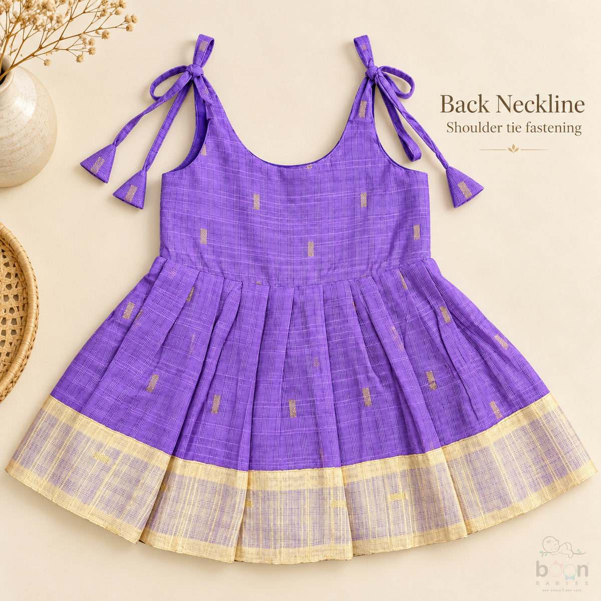 Purple tissue silk cotton baby girl knot frock back view with shoulder tie fastening and pleated skirt