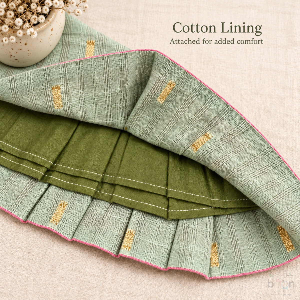Cotton lining construction detail inside sage green tissue silk cotton baby girl knot frock