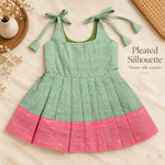 Sage green tissue silk cotton baby girl knot frock front view with tie-up shoulders, pleated skirt and pink border