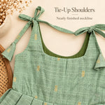 Tie-up shoulder and neatly finished neckline detail on sage green tissue silk cotton baby girl frock