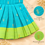 Pleated skirt and textured tissue silk cotton detail on turquoise baby girl knot frock