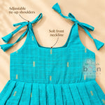 Adjustable tie-up shoulder detail on turquoise tissue silk cotton baby girl frock