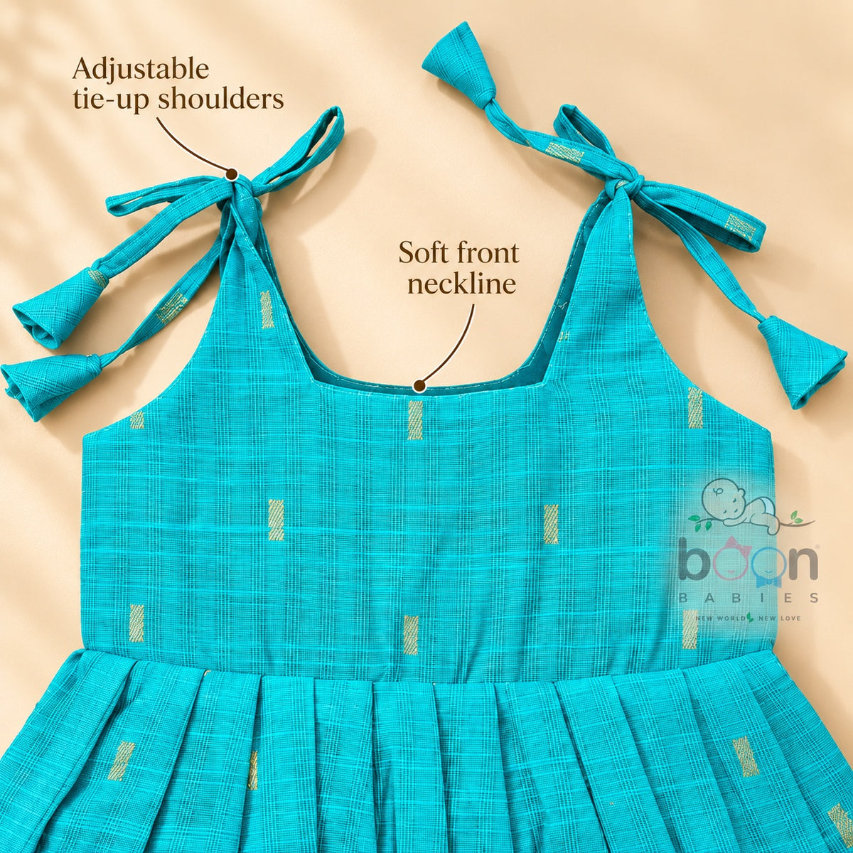 Adjustable tie-up shoulder detail on turquoise tissue silk cotton baby girl frock