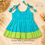 Turquoise tissue silk cotton baby girl knot frock front view with tie-up shoulders, pleated skirt and lime green border